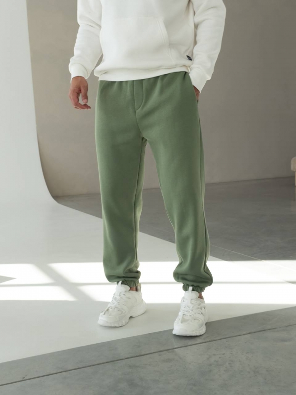 Теплые мужские зеленые спортивные штаны на флисе свободного кроя Б-697