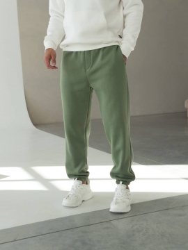 Теплые мужские зеленые спортивные штаны на флисе свободного кроя Б-697