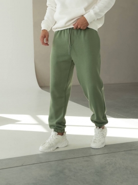 Теплые мужские зеленые спортивные штаны на флисе свободного кроя Б-697