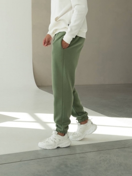 Теплые мужские зеленые спортивные штаны на флисе свободного кроя Б-697