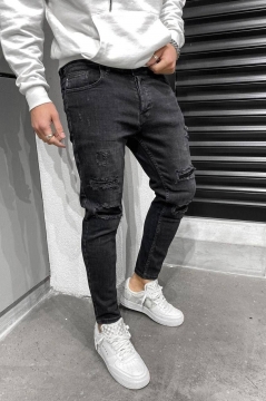 Темно-сірі джинси з дірками D-578